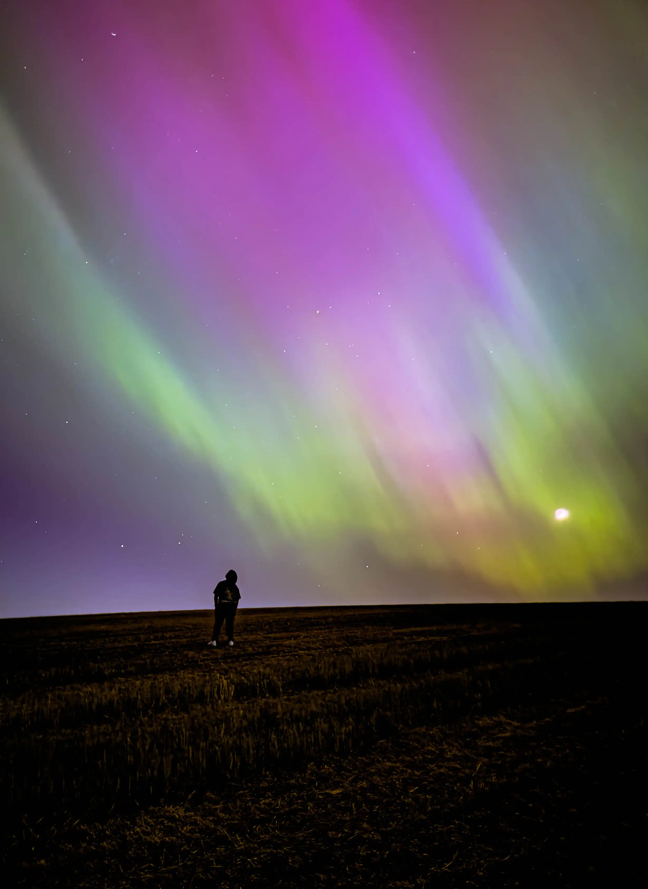 Riley Smith looking at the aurora borealis